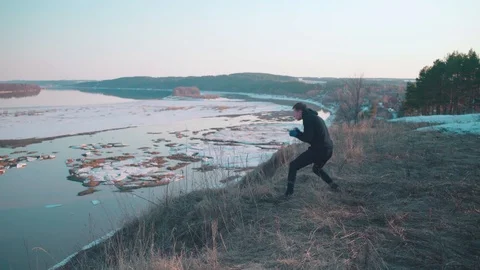 A young man training with beatiful view behind Stock Footage 106510640