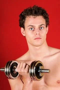 Young man training with dumbbell Foto stock