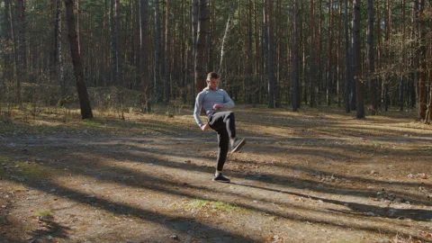 Young Man Is Training In Forest Stock Footage 166350961