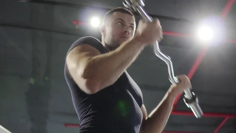 A young man is training in the gym. 4K Stock Footage 73780649