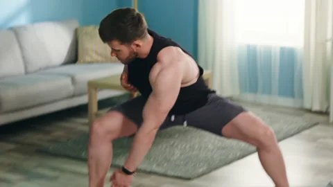 Young Man Is Training at Home Stock Footage 135317254