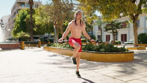 Young man training jump rope exercise at park Video stock 171067101