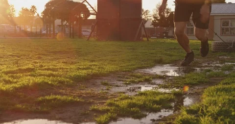 Young man training at an outdoor gym bootcamp Stock Footage 116002071