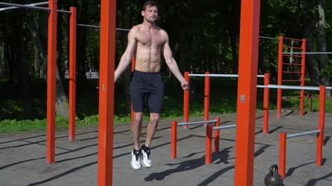 Young man training on skipping rope on outdoor workout. Stock Footage 130819131