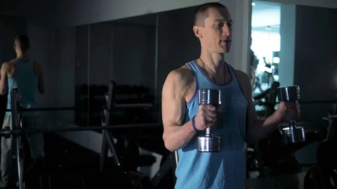 A young man is training. Training in the gym Stock Footage 84673462