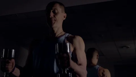 A young man is training. Training in the gym Stock Footage 84677184