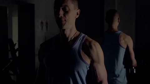 A young man is training. Training in the gym Stock Footage 84677999