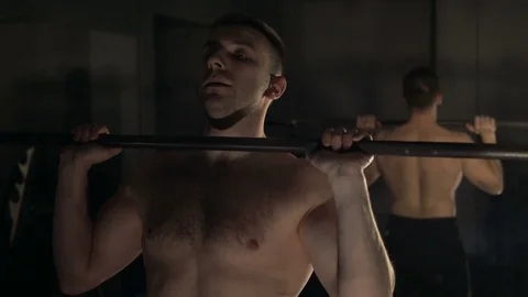A young man is training. Training in the gym Stock Footage 84748572