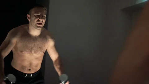 A young man is training. Training in the gym Stock Footage 84749298