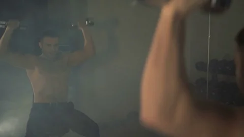 A young man is training. Training in the gym Stock Footage 84750378