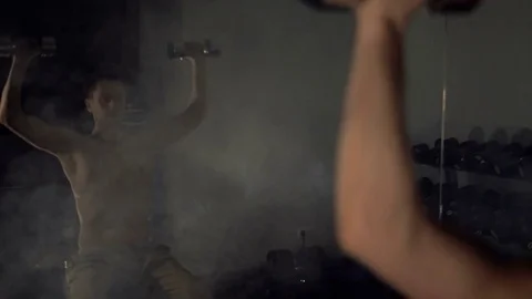 A young man is training. Training in the gym Stock Footage 84750617