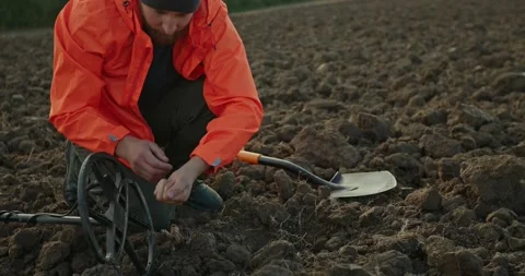 Young man treasure hunter doing archeology in the field. Stock Footage 272319475