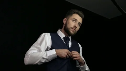 Young man with trendy beard posing for photographer.  Stock Footage 75228472