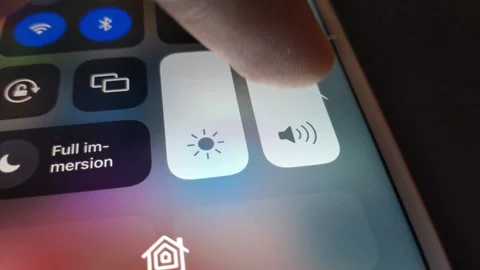 Young man turn off volume on the iphone setting. mute iphone from setting. Stock Footage 247184902