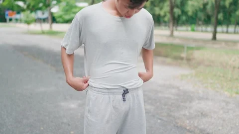 Young man turns to exercise because of weight gain. Fitness training, health Stock Footage 283186929