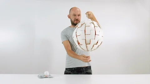 The young man turns on the lamp Stock Footage 102782759