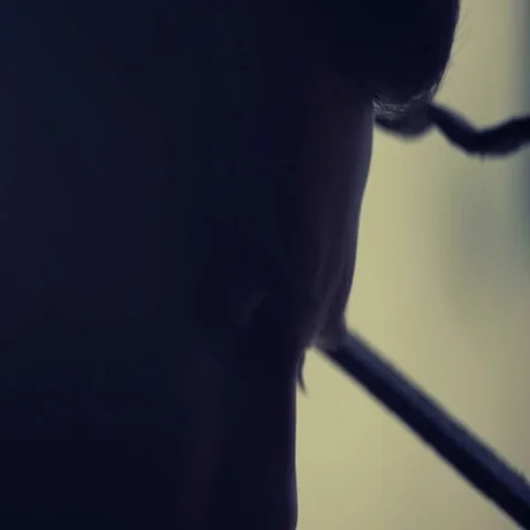 Young man in twilight looks at the camera sadly Stock Footage 69515986