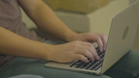 Young Man Types on Laptop Stock Footage 60989309