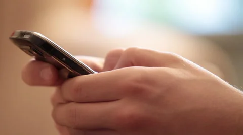 Young man types the text on mobile. Stock Footage 982553