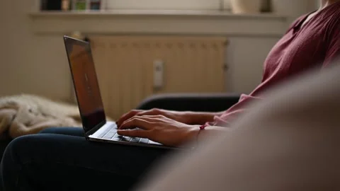 Young man typing on laptop Stock Footage 263253505