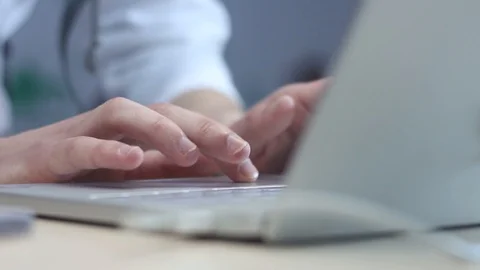 Young man typing on laptop in office Stock Footage 87136281
