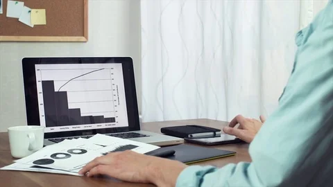 Young man typing message using tablet and laptop computer Stock Footage 81879836