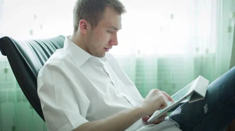 Young Man Is Typing On The Tablet Stock Footage 36197390