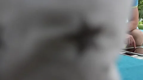 Young man typing on the tablet in nature Stock-Footage 65155757