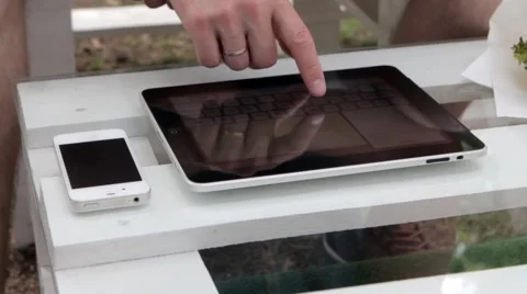 Young man typing on the tablet in nature Stock-Footage 65155762