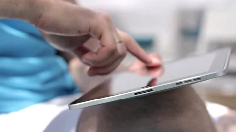 Young man typing on the tablet in nature Stock-Footage 65156298