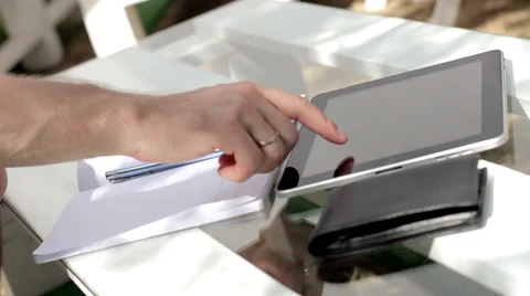 Young man typing on the tablet in nature Stock-Footage 65156450