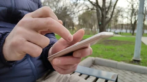 Young man is typing a text message Video stock 193021724