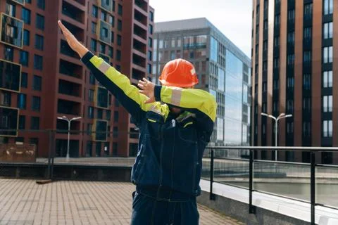 Young man in uniform shows dance movement dab, entertainment concept at the c Stock Photos
