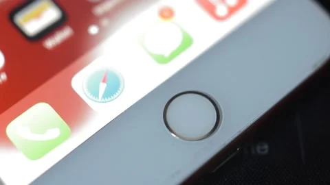 Young man unlock iphone with touch ID fingerprint. touchid identification. Stock Footage 234873345