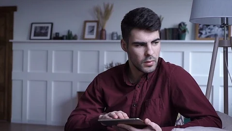 Young Man Use Computer Digital Tablet Home Entertainment Activity Stock Footage 105314957