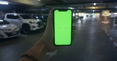 Young man use green display smartphone chroma key phone straight view. caucasian Stock Footage 248622596