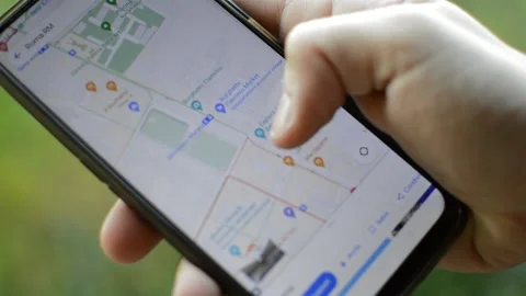 Young man use internet google maps gps technology on his phone Video stock 174669856