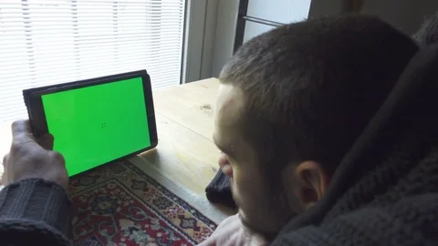 Young Man Use Tablet in Modern Apartment, Green Screen Stock Footage 72162031