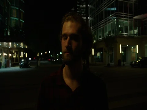 Young Man Uses Cell Phone at Night 스톡 동영상 77205908