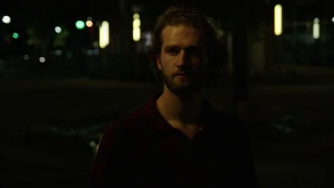 Young Man Uses Cell Phone at Night 스톡 동영상 77206018