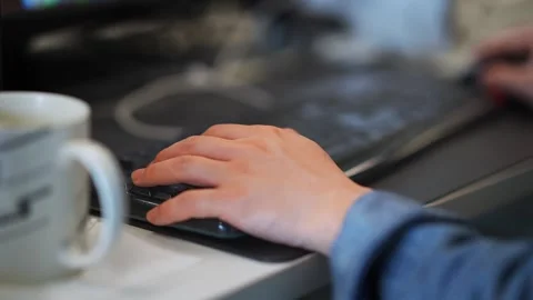 Young man uses computer in office Stock Footage 168273710