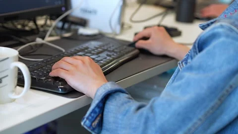 Young man uses computer in office Stock Footage 168273731