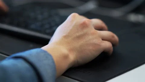 Young man uses computer in office Stock Footage 168273759
