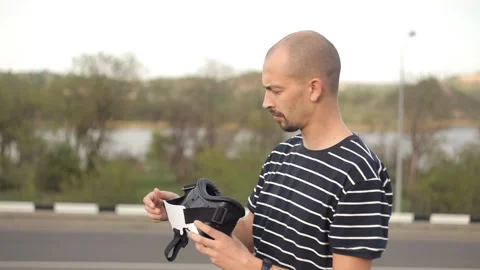 The young man uses the helmet of virtual reality for the first time.View images 스톡 동영상 92281074