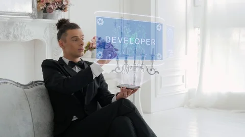 Young man uses hologram Developer Stock Footage 118045997