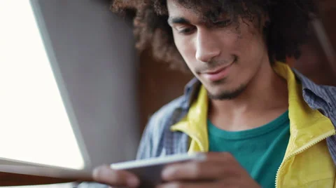 A young man uses the phone Stock Footage 38339353
