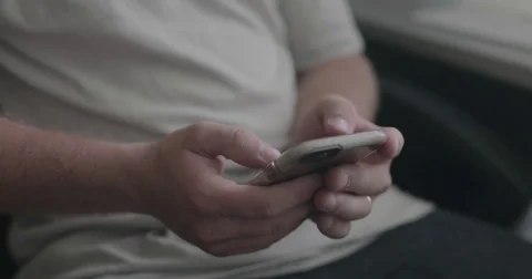 Young man uses smart phone Stock Footage 78037430