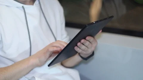 Young man uses a smartphone on the bus Stock Footage 87136349