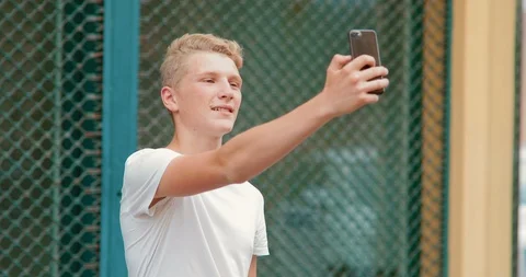 A young man uses a smartphone Stock Footage 91513017