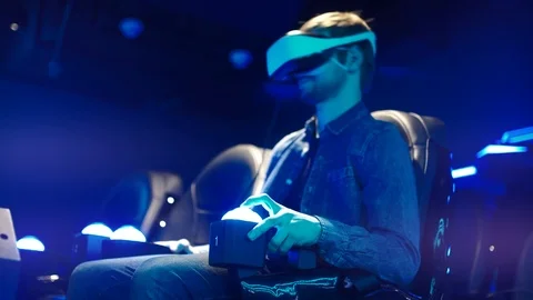 Young Man Uses Vr-Headset Display For Virtual Reality Video Game In Vr Club Stock Footage 106013751